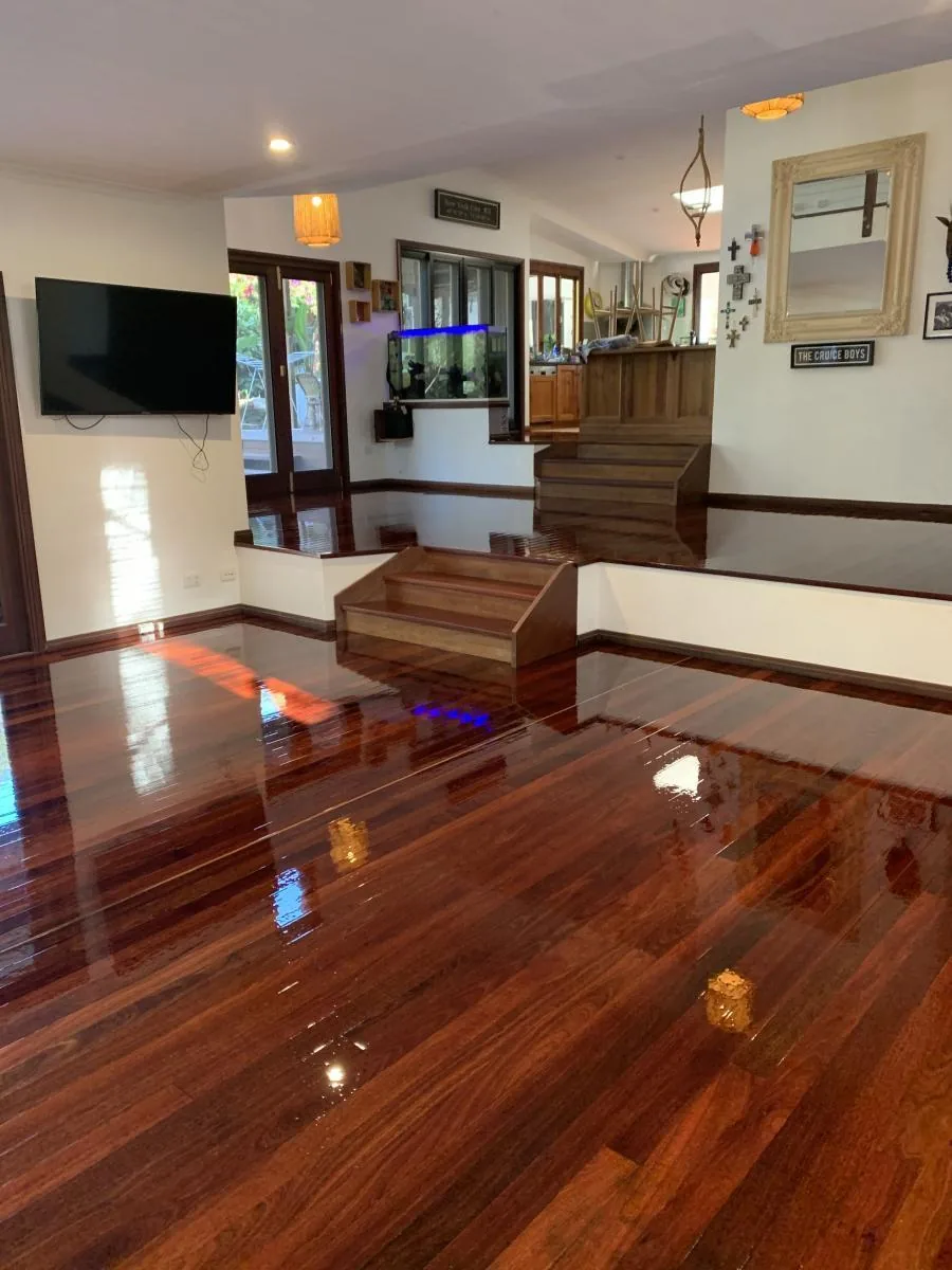 Completed living room with polished timber floors and timber steps