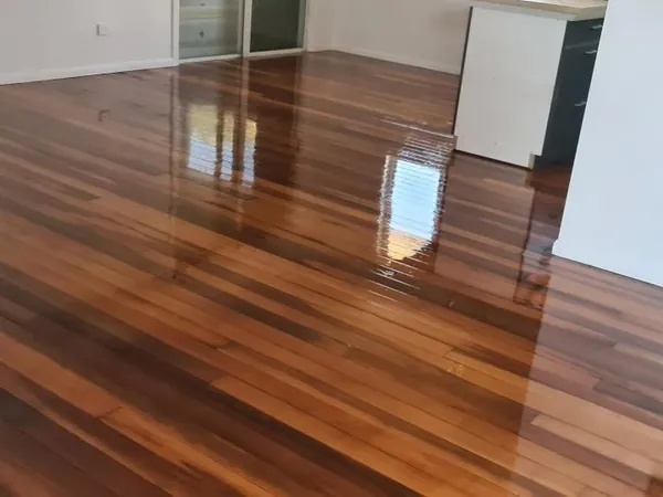 Glossy multicoloured timber floor in a room viewed from the doorway